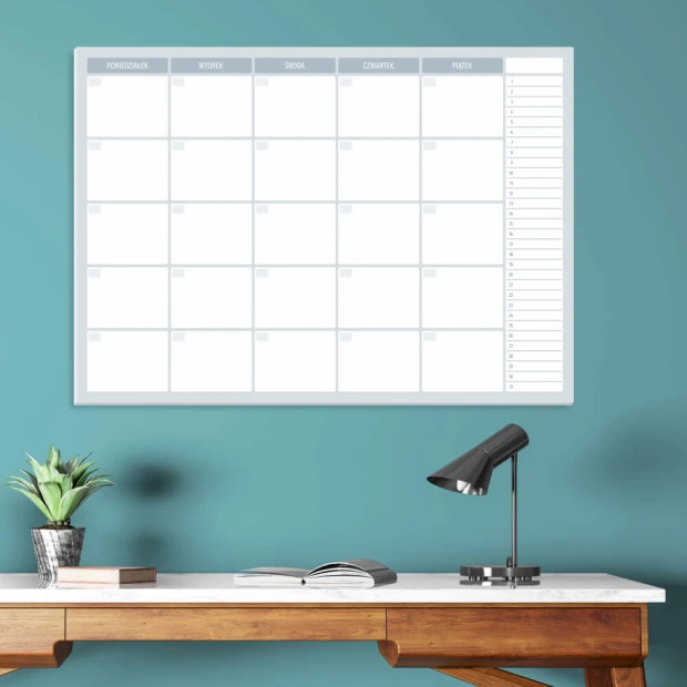 Weekly planner whiteboard 510 - Office setup with blue walls and a wooden desk with a lamp.