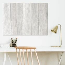 Whiteboard with a magnetic surface, ideal for office decor. Light-colored walls and minimalist furniture.