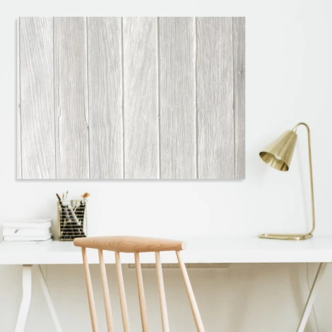 Whiteboard with a magnetic surface, ideal for office decor. Light-colored walls and minimalist furniture.