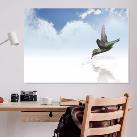 Magnetic dry-erase board bird 211 - Graphic design featuring a hummingbird flying over water with a blue sky and clouds.
