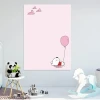 Magnetic dry-erase board for kids featuring a bear design, ideal for a bright children\'s room with light-colored walls and furniture.