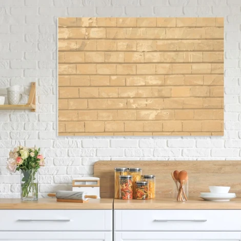 Magnetic dry-erase board with a brick design, perfect for kitchen decor. Light-colored walls and wooden furniture.