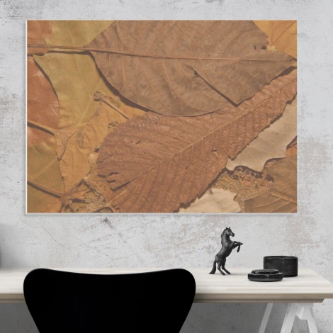 Magnetic dry-erase board with leaf design in shades of brown and beige.
