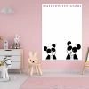 Dry-erase magnetic board for kids featuring bears, perfect for a child\'s room with pink walls and furniture.