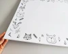 Dry-erase magnetic board for kids featuring animal designs on a white background.