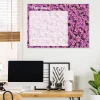 Dry-erase magnetic board with floral design for daily planning, ideal for bright office spaces with wooden furniture.