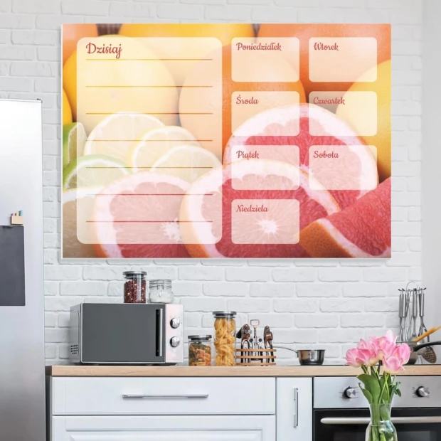 Magnetic dry-erase weekly planner with grapefruit design, perfect for modern kitchen decor with light-colored walls.