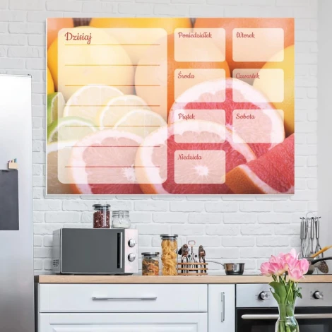 Magnetic dry-erase weekly planner with grapefruit design, perfect for modern kitchen decor with light-colored walls.