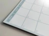 Magnetic dry-erase weekly planner board 513 - Simple grid design with rectangles for each day of the week.