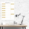 Magnetic dry-erase weekly planner 407 - Office setup with white walls, wooden table, and metal lamp.