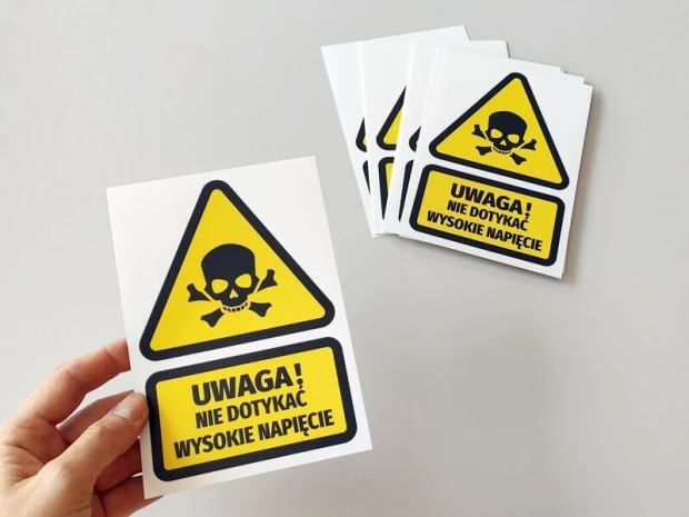 High Voltage Do Not Touch Sticker - Graphic design. Triangular shape with skull and crossed bones.
