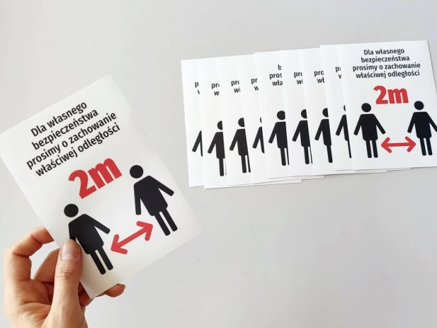 2m social distancing sticker N478 - Graphic design with human figures and directional arrows on a white background.