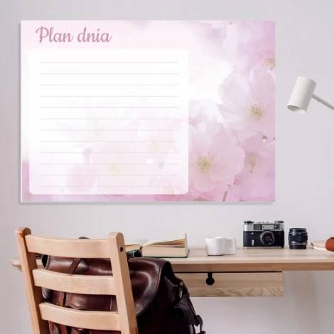 Dry-erase magnetic board daily planner with floral design on a light pink background featuring delicate flowers.