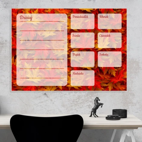 Magnetic dry-erase weekly planner with autumn leaves design and colorful leaf background, featuring spaces for days.