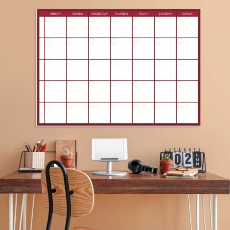 Magnetic dry-erase weekly planner in English, ideal for office decor. Brown walls and table.