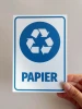 Paper bin sign - Graphic design. Round recycling symbol with blue arrows and the word Paper.