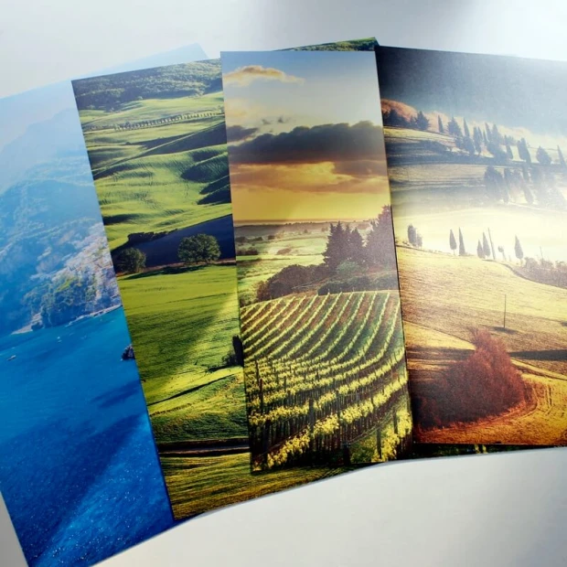 Photo poster 30x40 cm - Graphic design. Three landscapes with green fields, mountains, and sky.