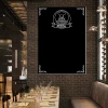 Chalkboard with pizza print 084 - Restaurant decor. Dark brick walls, wooden tables, and chairs.