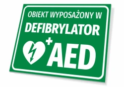 Sign indicating the facility is equipped with an AED - Graphic design. Green background with white text and heart symbol.