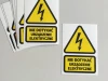 Do not touch sticker, electrical device - Graphic design. Yellow triangle with black lightning bolt and text.