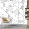 Geometric pattern wallpaper 041 for the living room - modern interior design with light-colored walls and wooden flooring.