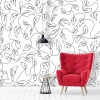Leaf wallpaper 053 - Living room setup with light walls, a red armchair, and a black lamp.
