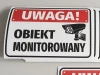 Warning monitored area sticker - Rectangular design with red background, white text, and camera graphic.