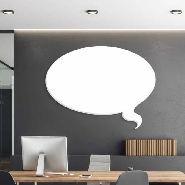 Dry-erase magnetic board for the office, featuring gray walls and modern furniture in the arrangement.