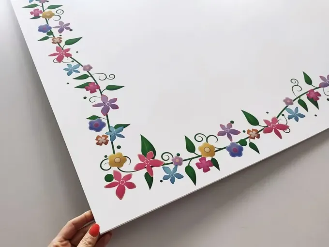 Magnetic dry-erase board for kids with colorful birds, featuring a design of flowers and leaves on a white background.