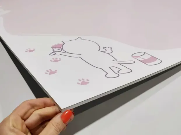 Dry-erase magnetic board for kids featuring a cat design. The outline of a cat painting is visible on a white background.