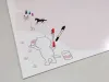 Dry-erase magnetic board for kids featuring a cat design with an outline of a cat painting.