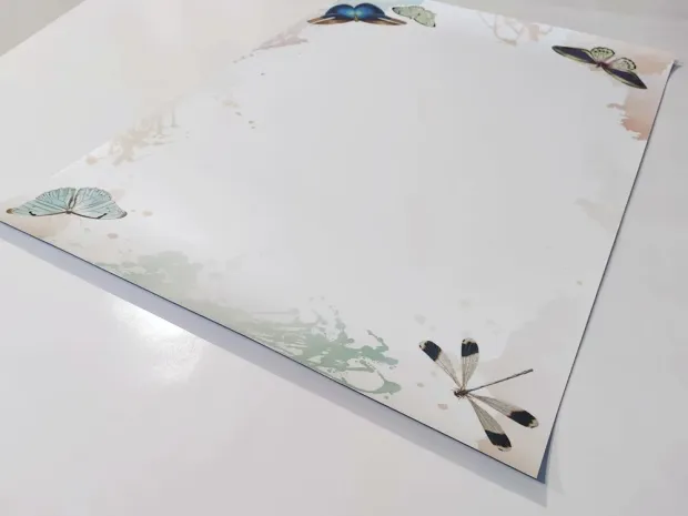 Magnetic dry-erase board for kids featuring butterflies on a white background.
