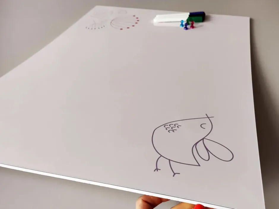 Magnetic whiteboard with a dandelion and bird design. Features a bird illustration on a white background.