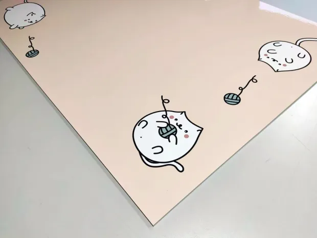 Dry-erase board for kids featuring playful cat designs on a light background with yarn.