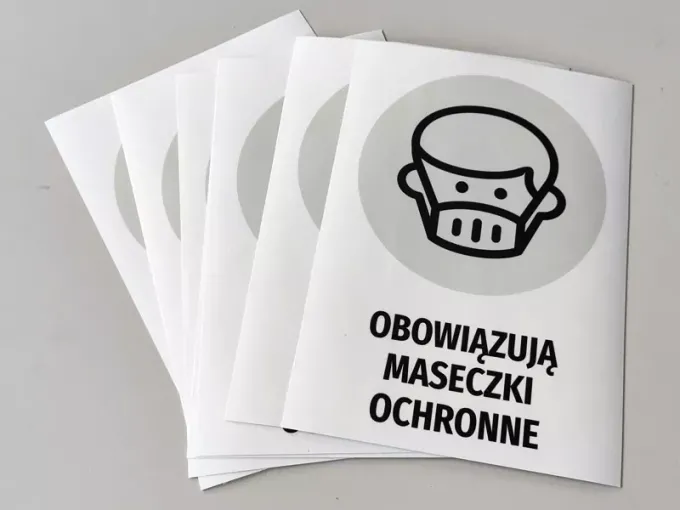 Sticker: Face masks required - Graphic design featuring a face icon in a mask and text.