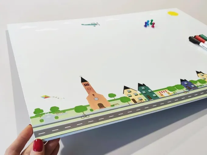 Dry-erase magnetic board for kids city 495 - Features colorful houses and a church design.