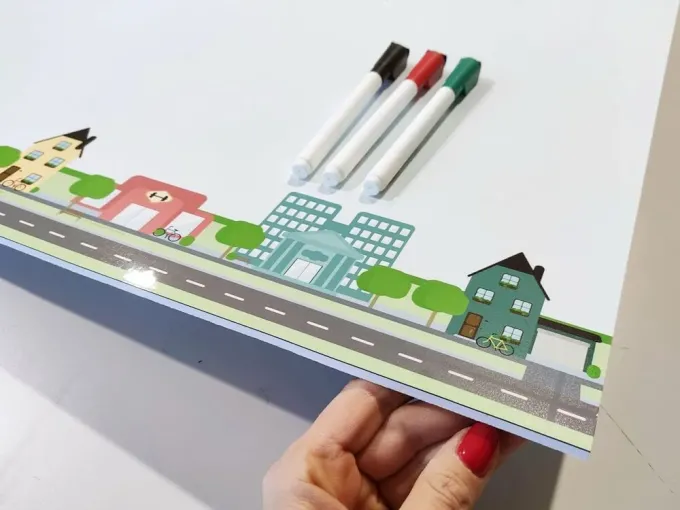 Magnetic dry-erase board for kids city design 495 - features a street with houses and trees.