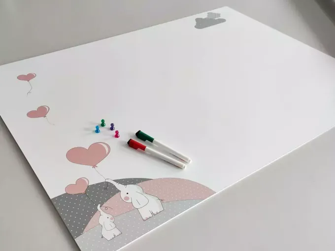 Dry-erase magnetic board for kids featuring elephants holding balloons.