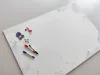 Dry-erase magnetic board for kids, watercolor design with colorful splashes on a white background.