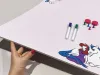 Dry-erase magnetic board for kids with unicorn design. Features colorful illustrations on a white background.