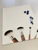 Magnetic whiteboard for makeup artists featuring a graphic design with makeup brushes on a white background.