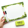 Custom dry-erase board with green plant accents, perfect for a modern office or workspace.