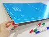Tactical dry-erase board for unihockey 184 - Graphic design with blue background and white field lines.