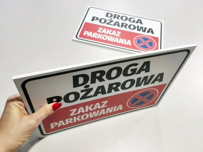 Fire route sign, no parking - Graphic design. Rectangular sign with white background and red text.