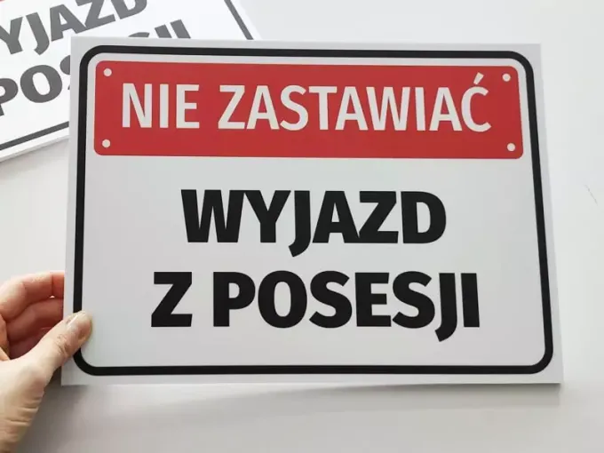 Do Not Block, Exit from Property - Graphic Design. Simple rectangle with red background and large black letters.