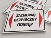Keep a safe distance sign - Rectangular sign with a white background, red arrows, and black text.