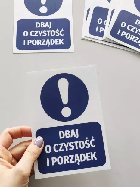 Cleanliness and Order Sticker - Graphic Design. White rectangle with blue background and white text.