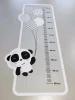 Child growth chart sticker with a panda holding balloons and measurement scale.