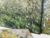 Reproduction of Flowering Plum Trees by Claude Monet. The artwork depicts blooming trees in shades of green.