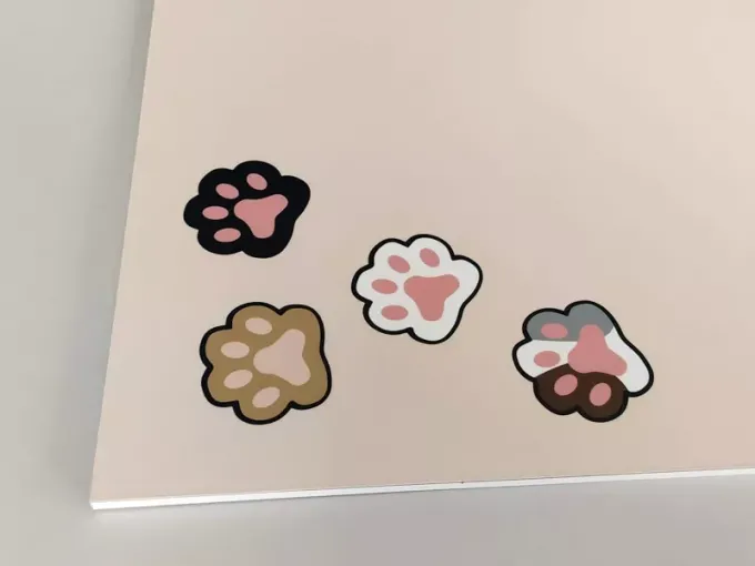 Dry-erase magnetic board for kids featuring a cat design with paw prints.